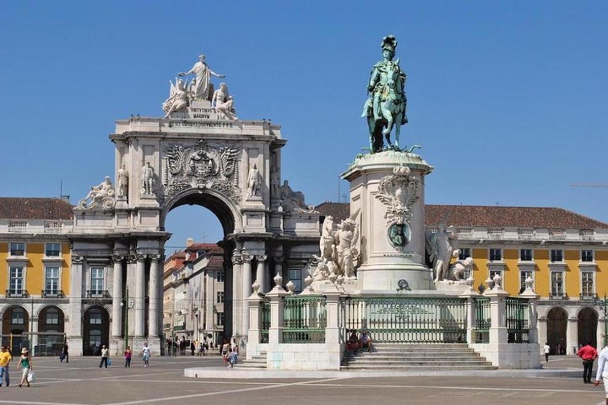 a statue in front of an arch in a building