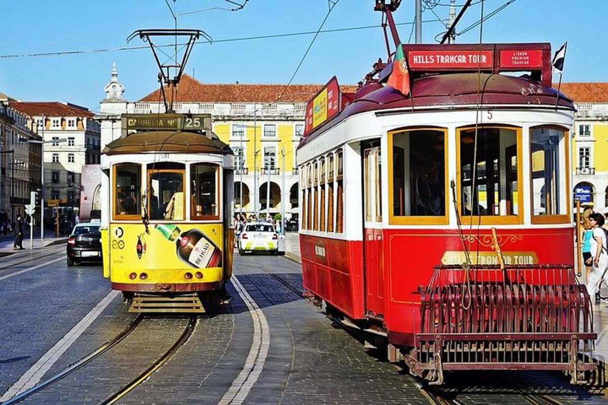 two trolley cars are parked on the street