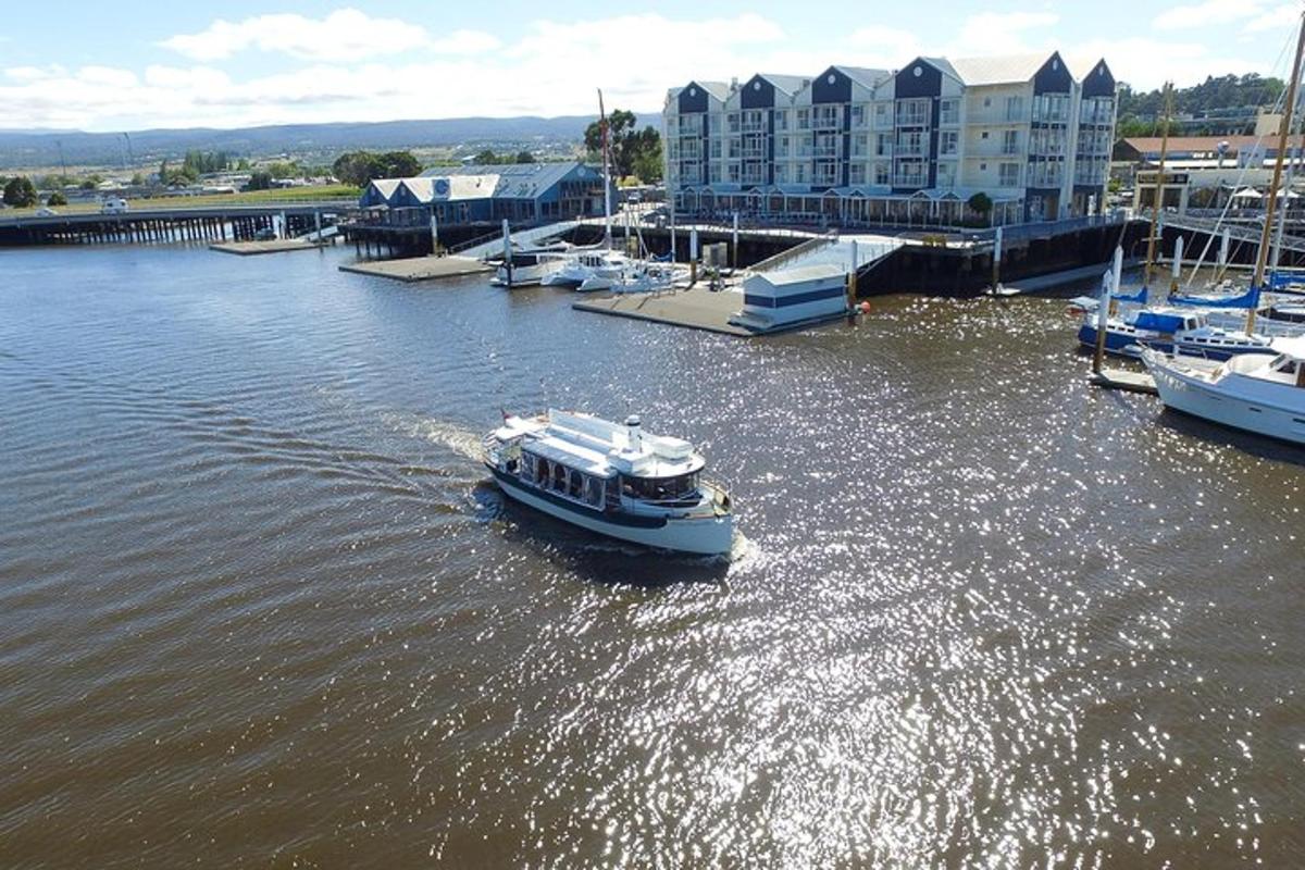 a small boat in the water in a marina