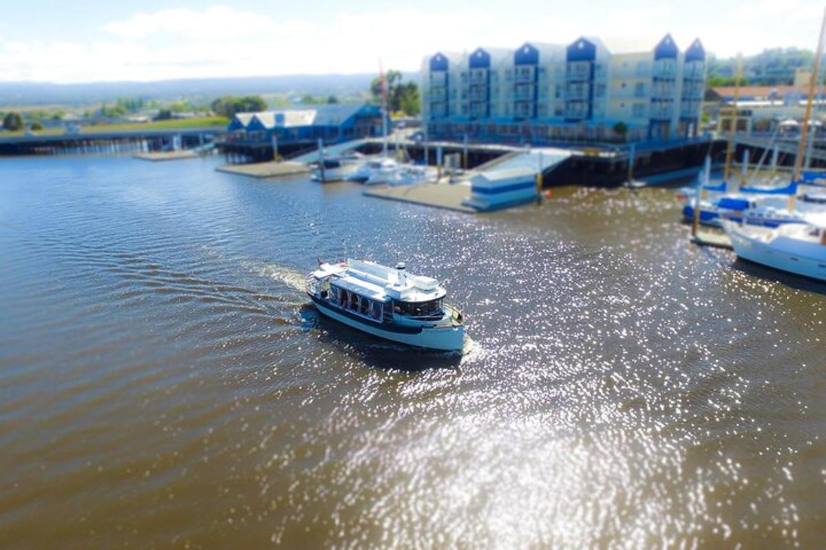 a small boat in the water in a harbor