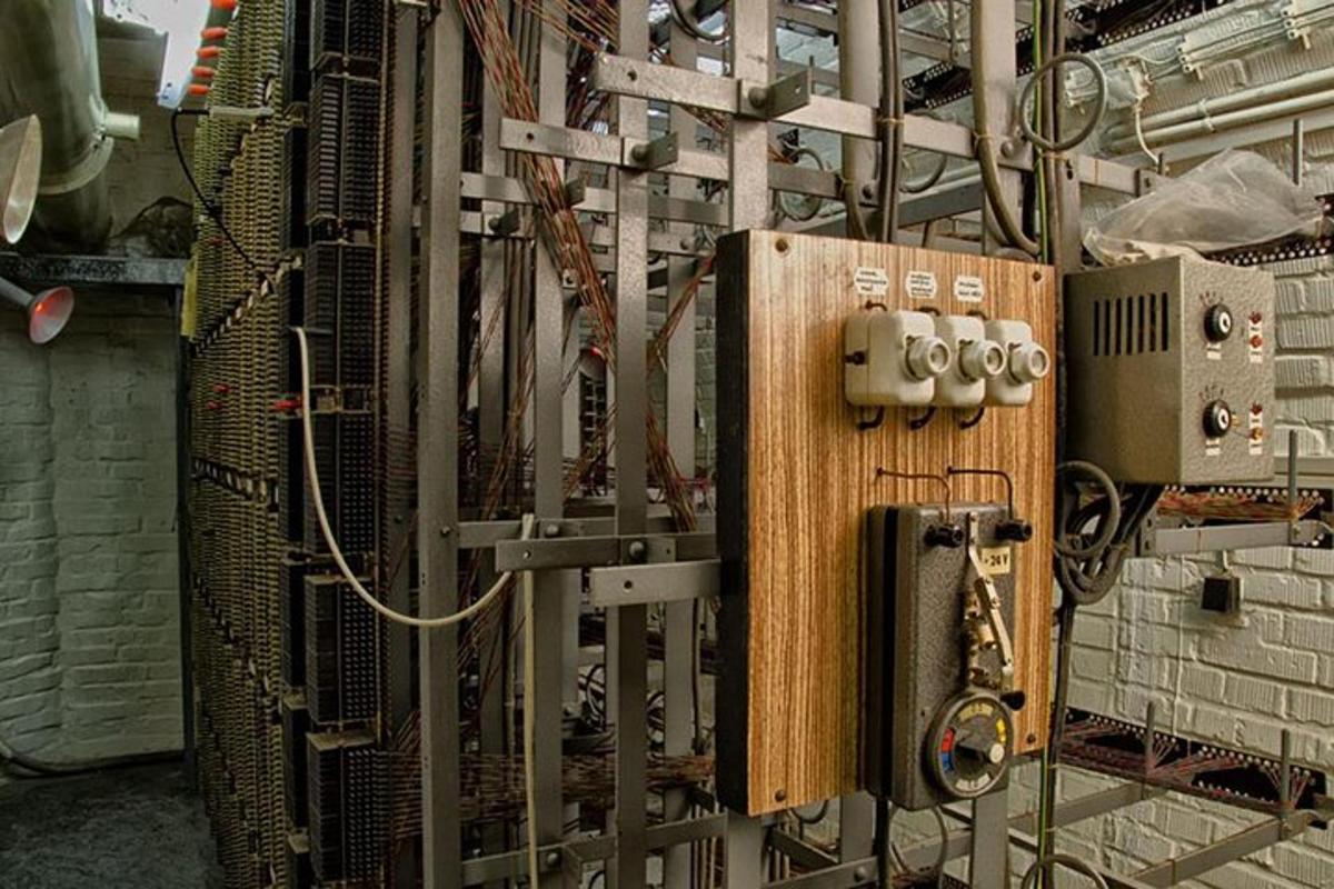 a metal wall with a switch in a room