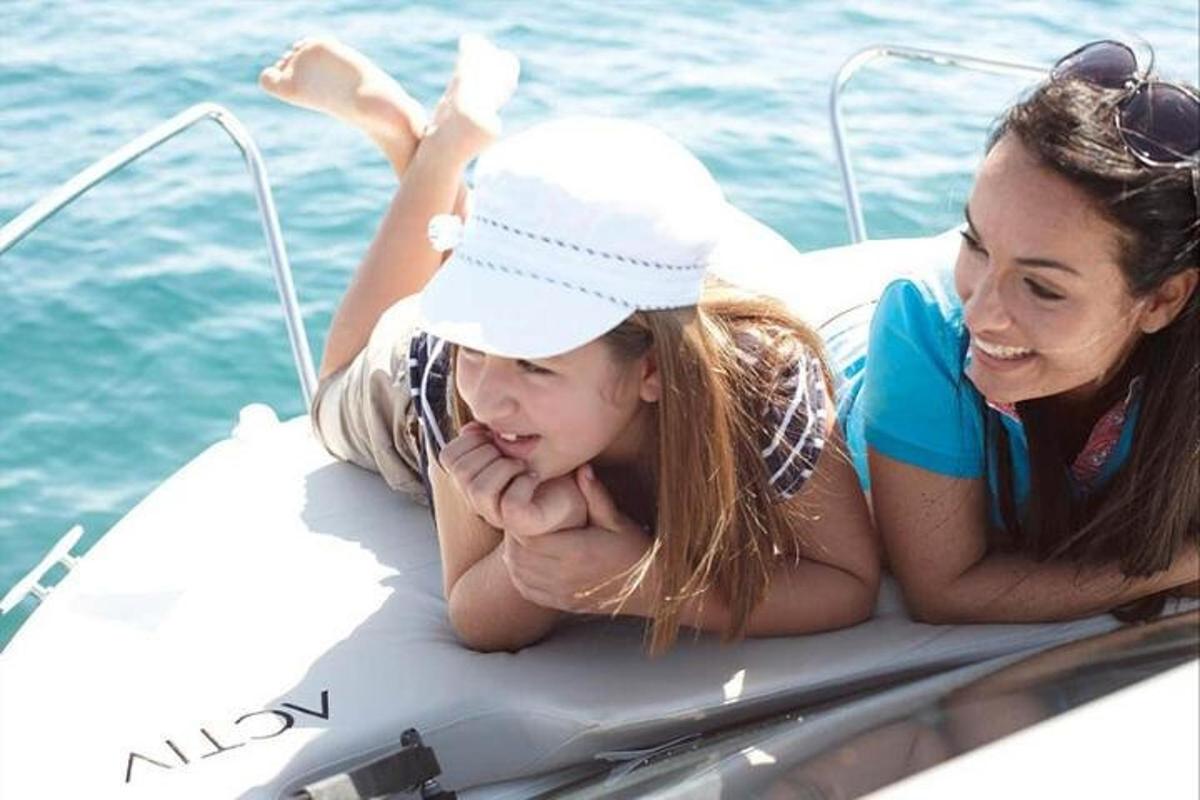 a woman and a little girl on a raft in the water