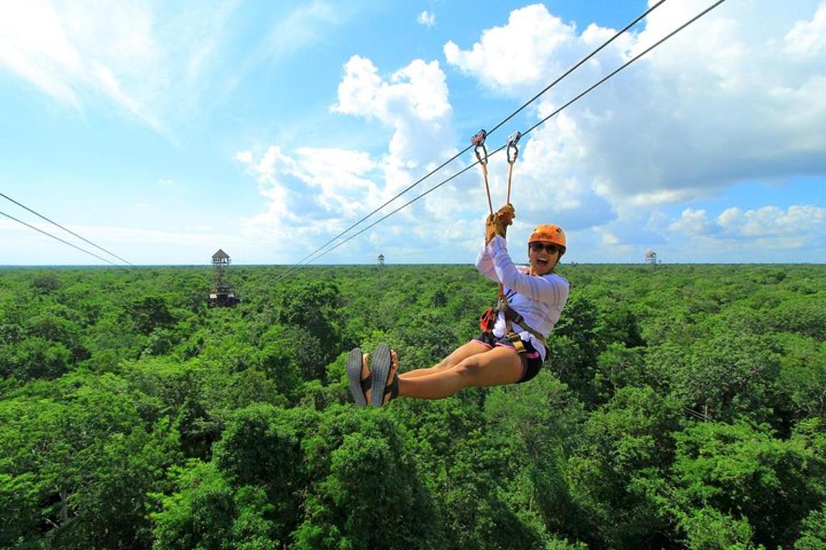 a woman is suspended in the air on a zip line