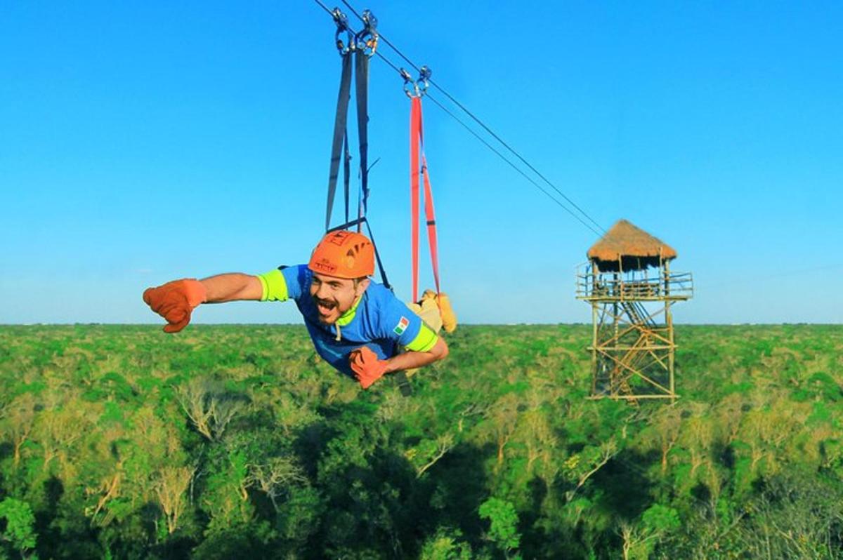 a man is hanging from a zip line