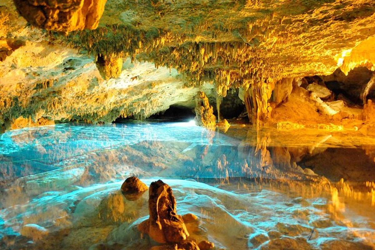 a cave with a pool of water inside of it
