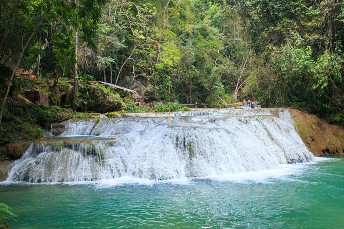 a waterfall in the middle of a river