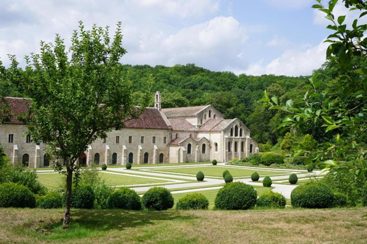 an exterior view of a large building with a yard