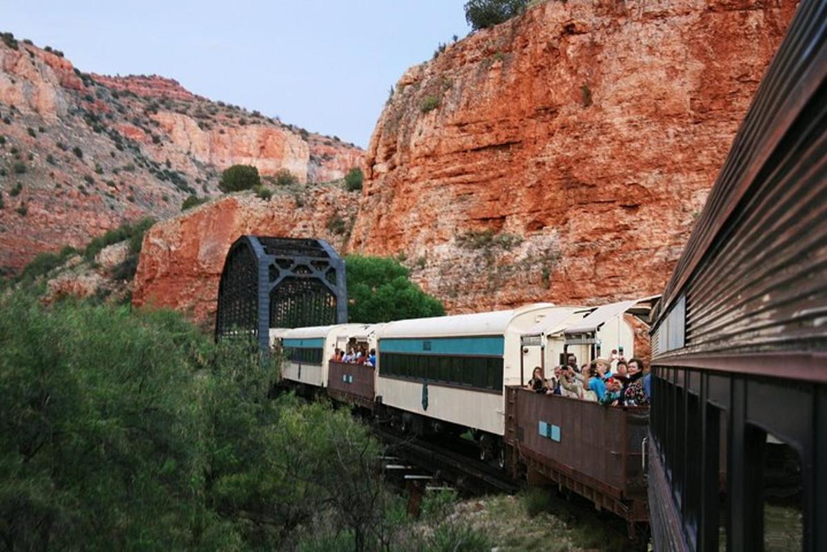 a group of people riding on a train going through a tunnel