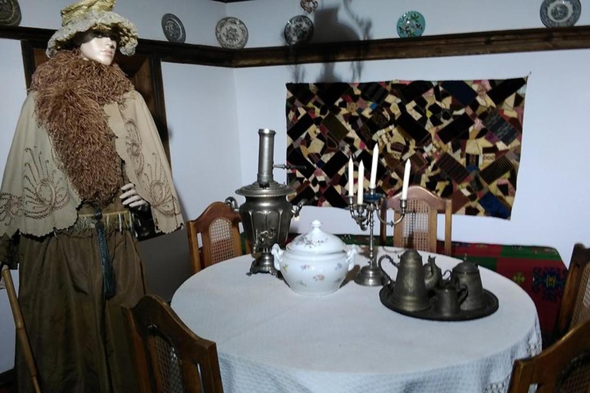 a mannequin standing next to a table in a room