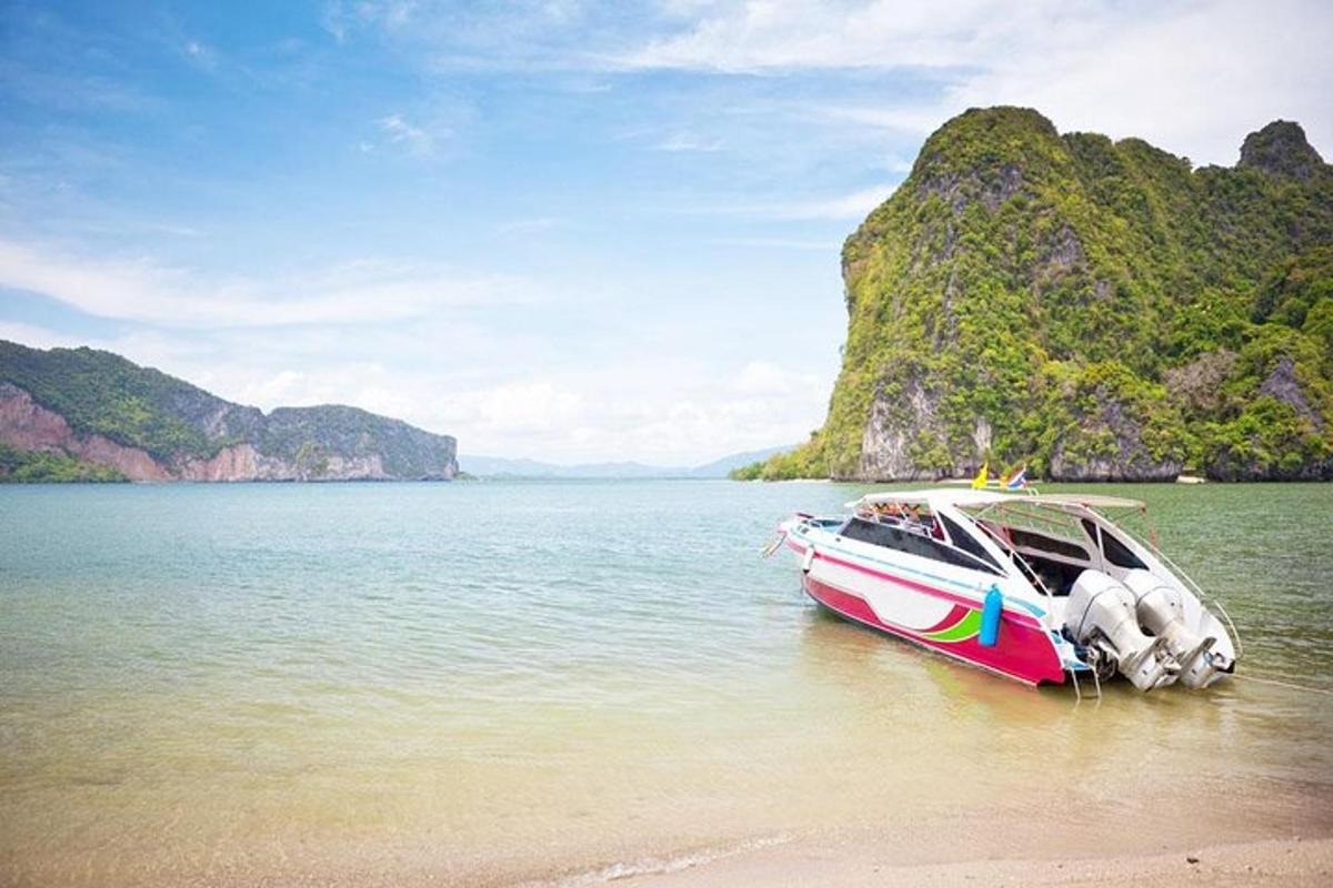 a boat sitting on the shore of a beach