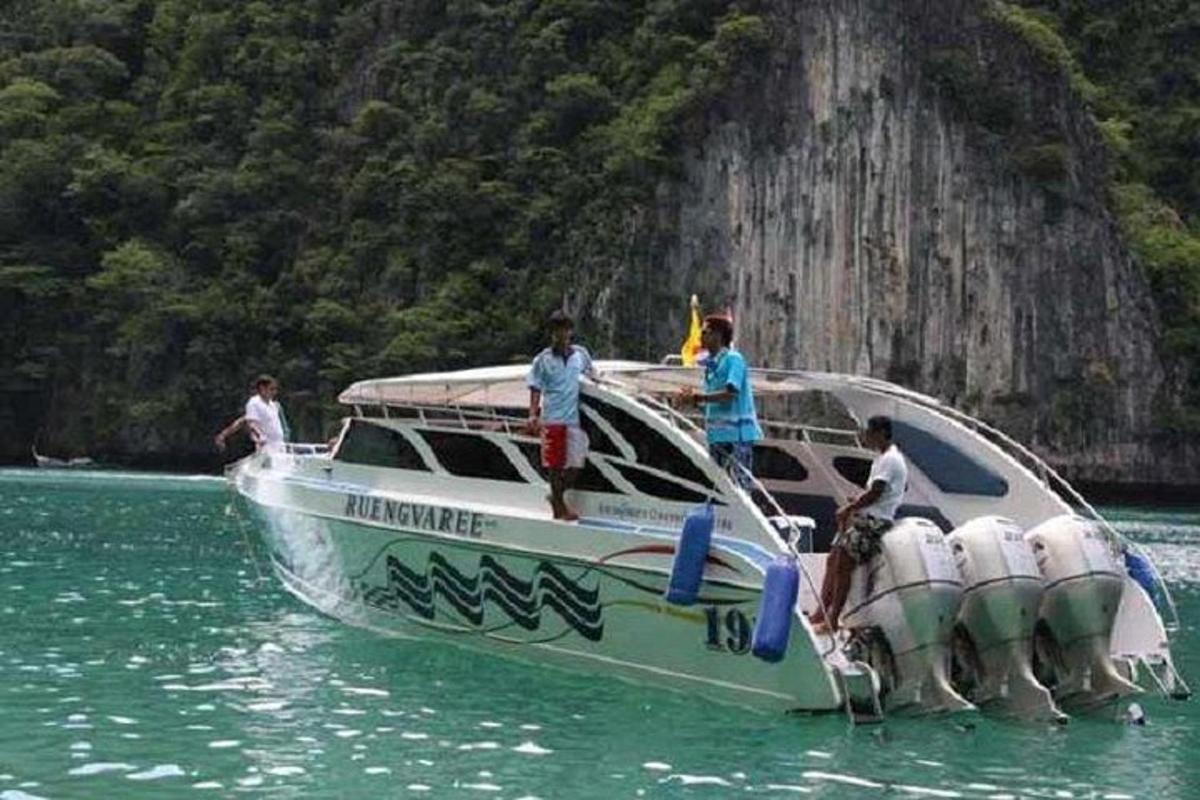 a group of people on a boat in the water