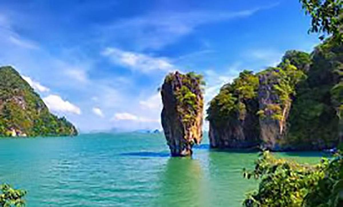 a large rock formation in the middle of the ocean