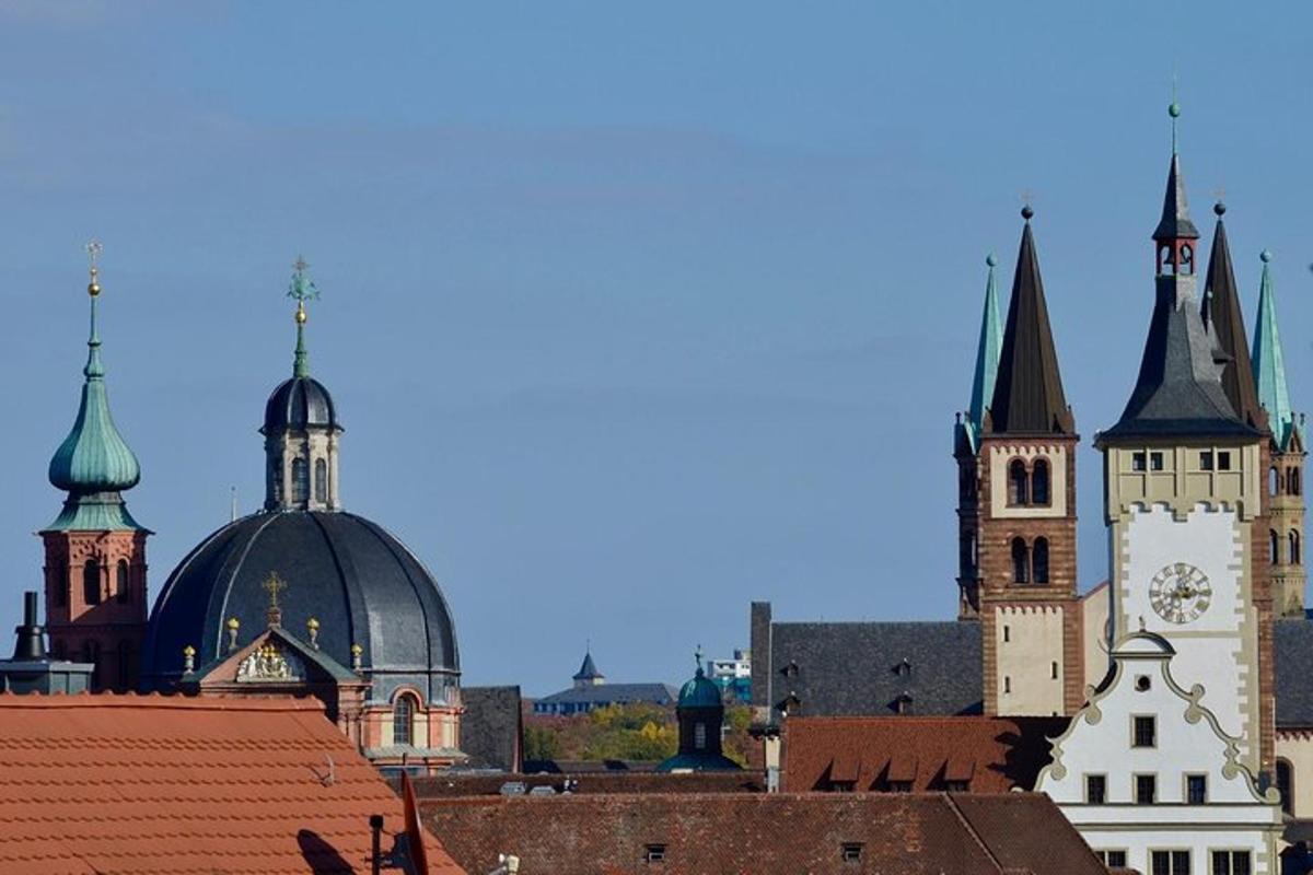 a group of buildings with roofs and a clock tower