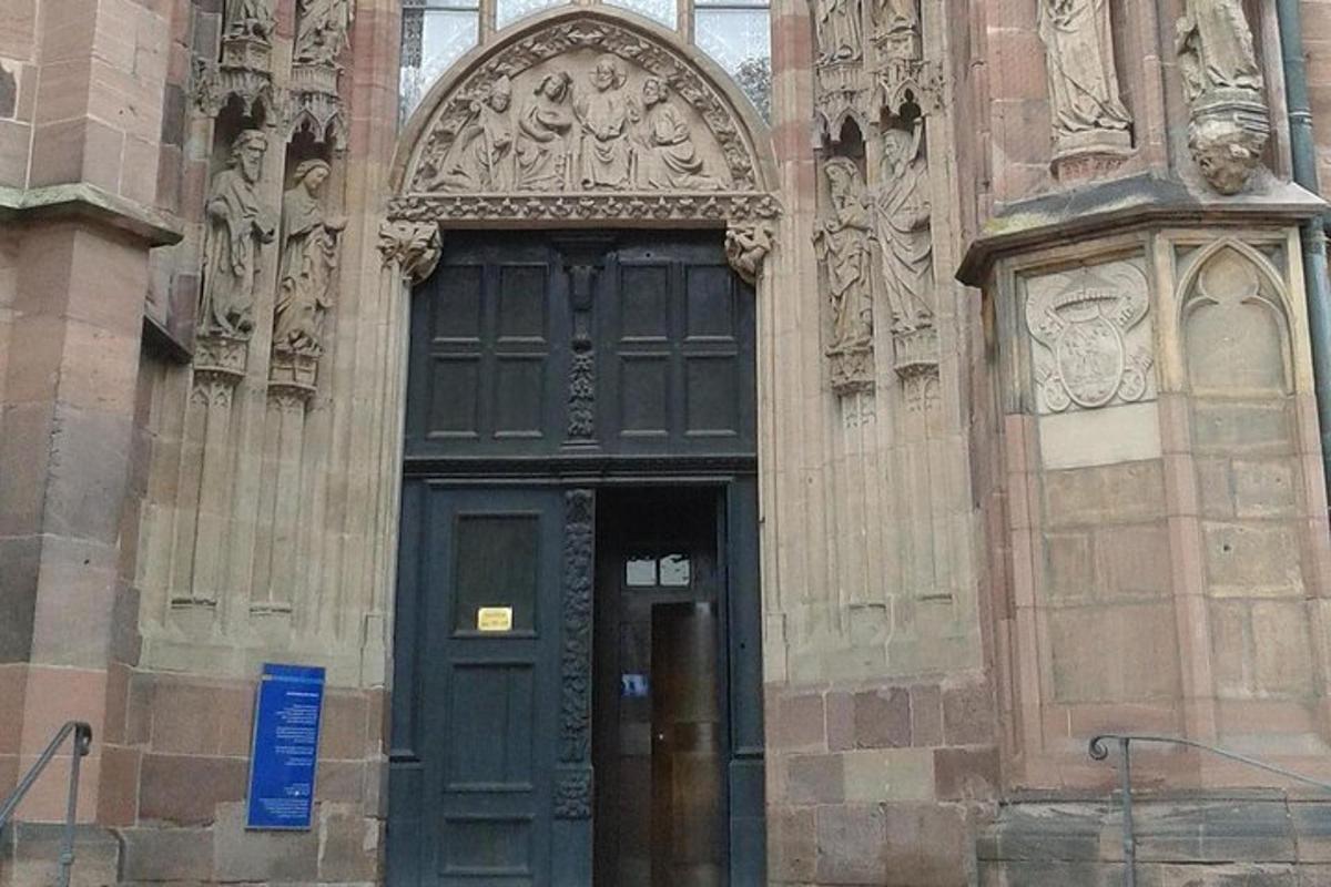 a building with a green door and a doorway