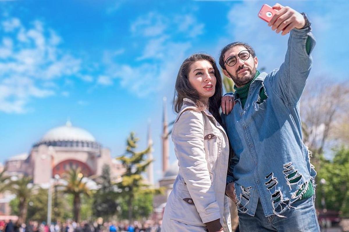 a man and a woman taking a picture with a camera