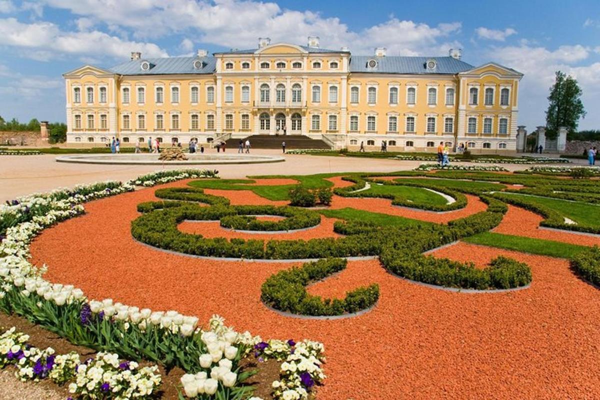 a large building with a garden in front of it