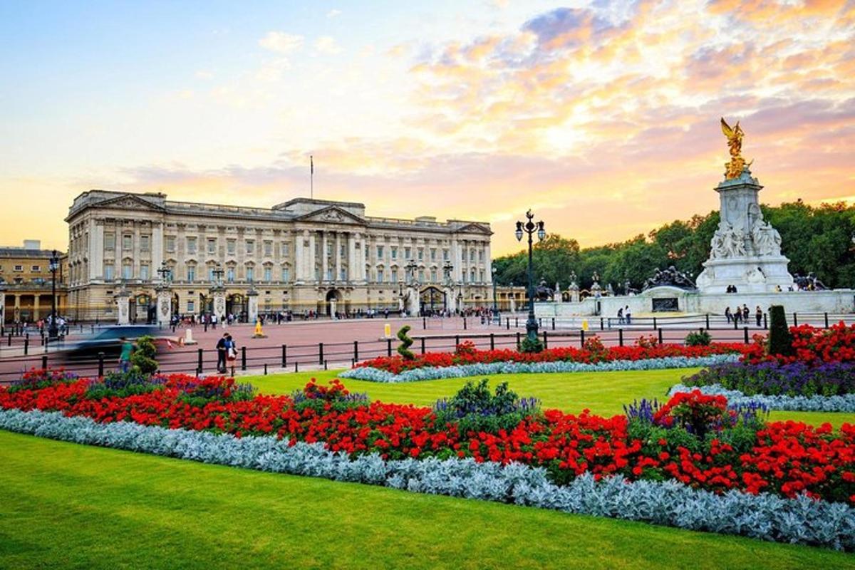 a park with flowers in front of a building