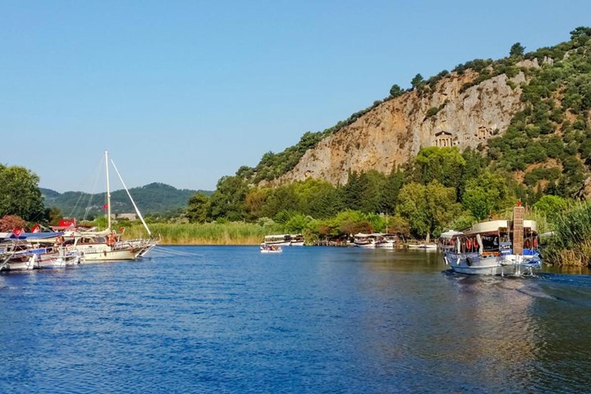a bunch of boats are docked on a river