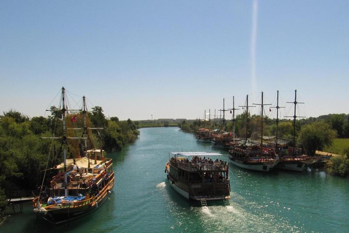 a group of boats are docked on a river