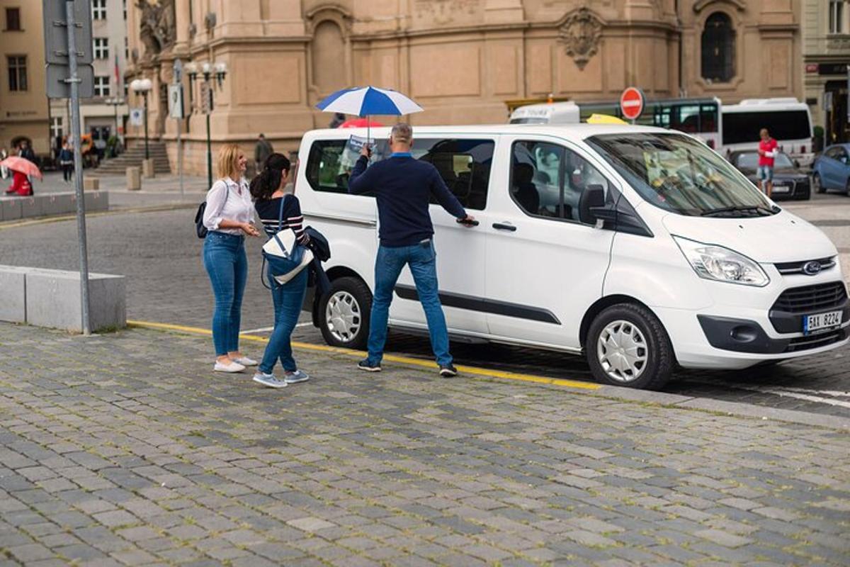 a group of people standing next to a white van