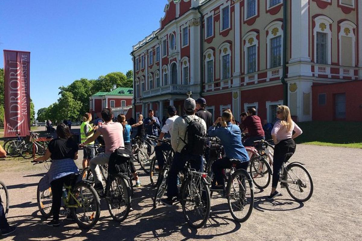 a group of people riding bikes down a street