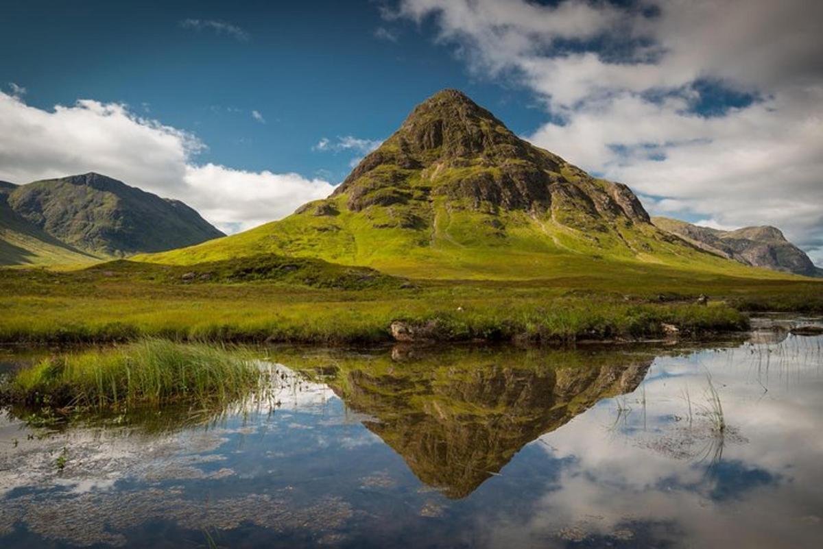 a mountain with its reflection in a body of water