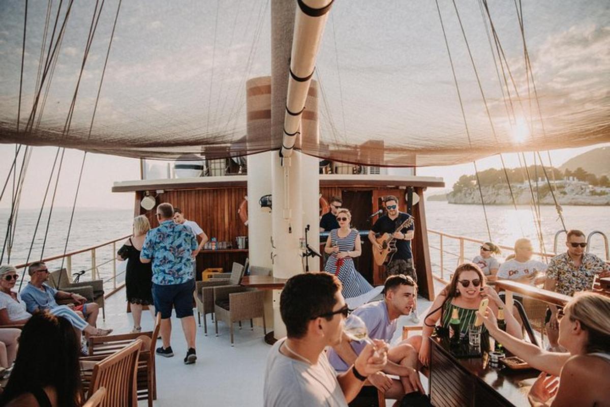 a group of people on the deck of a boat