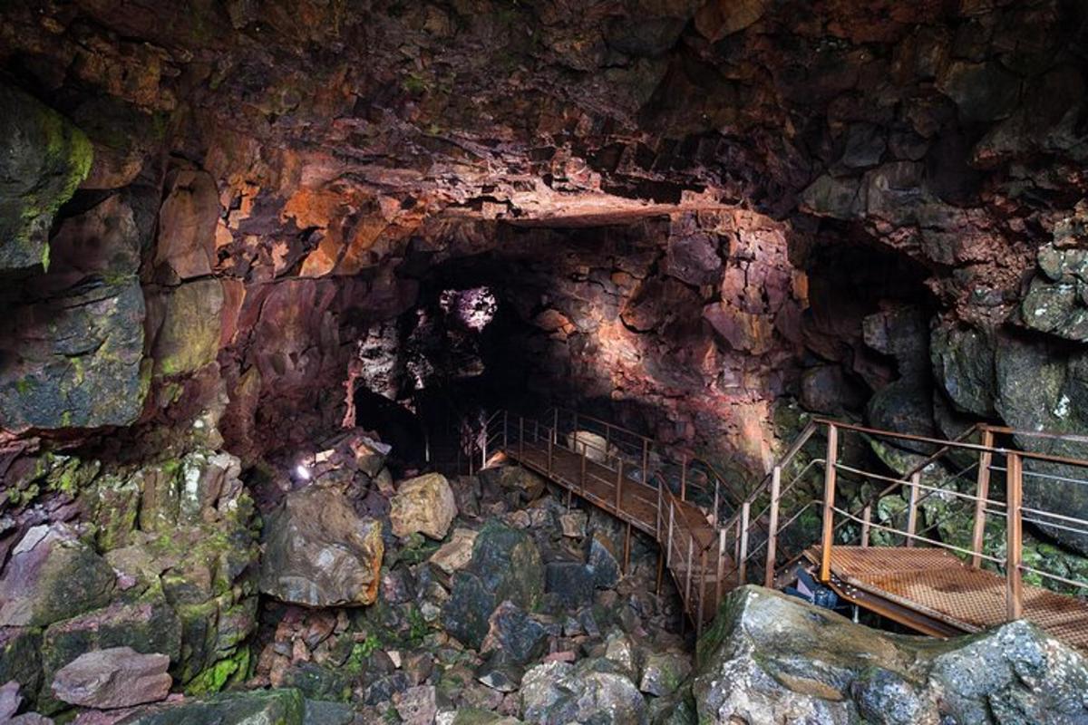 a cave with a staircase in a rock wall