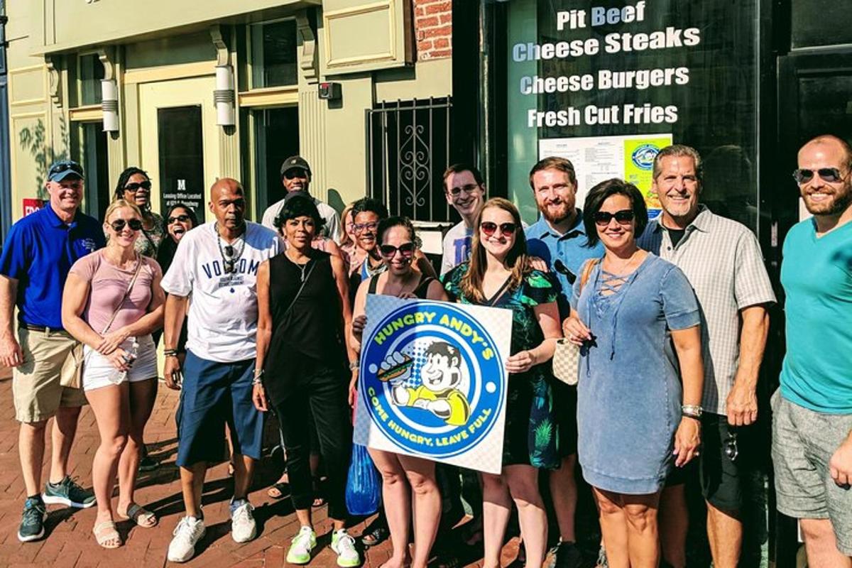 a group of people standing on a street holding a sign