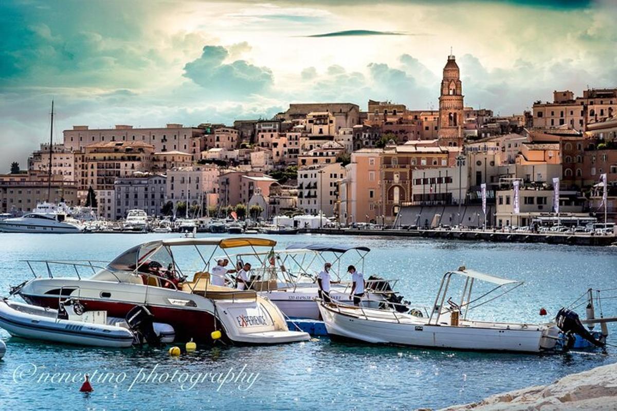 a group of boats docked in the water near a city