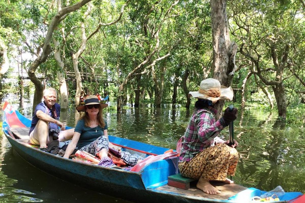 a group of people riding in a boat on the water
