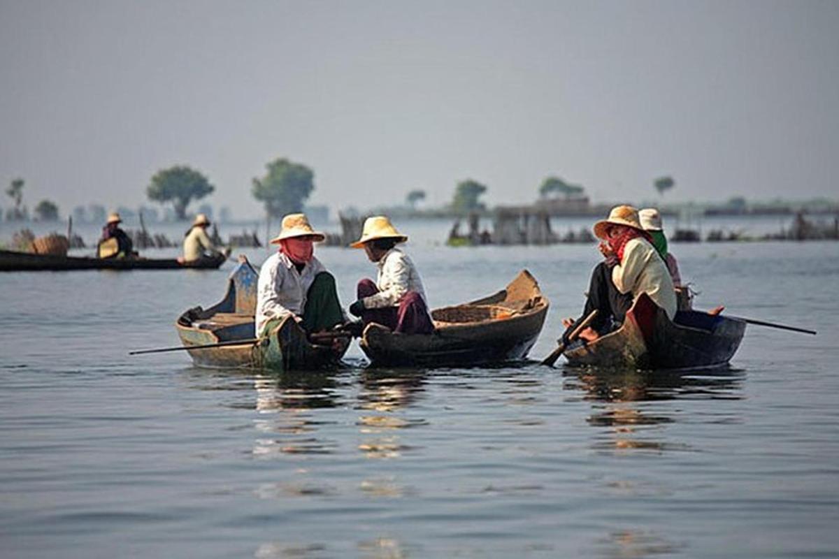 a group of people in boats on the water