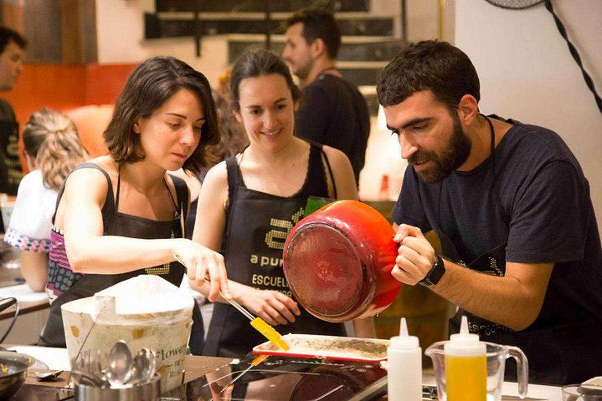 a group of people in a kitchen preparing food