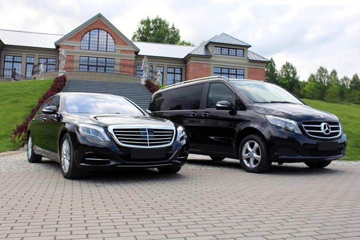 two vehicles parked in front of a house