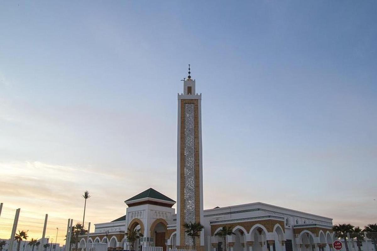 a building with a clock tower in front of it