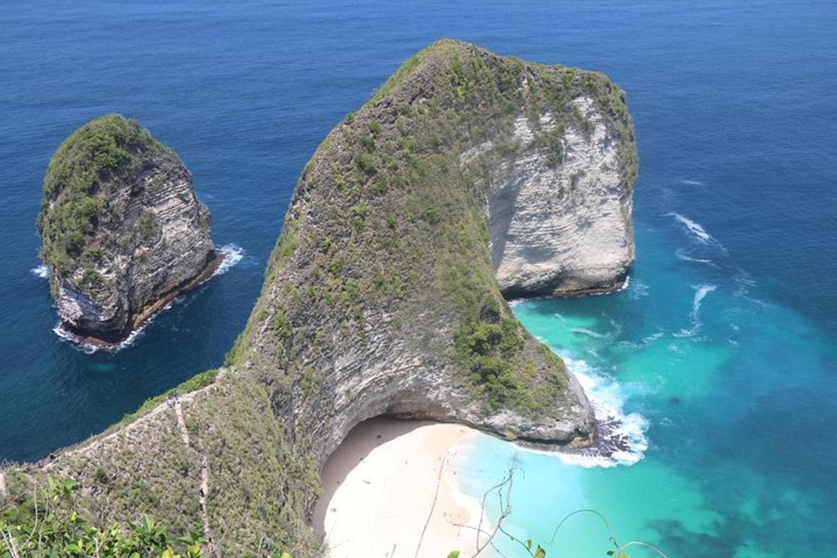 an aerial view of two rocky islands in the ocean