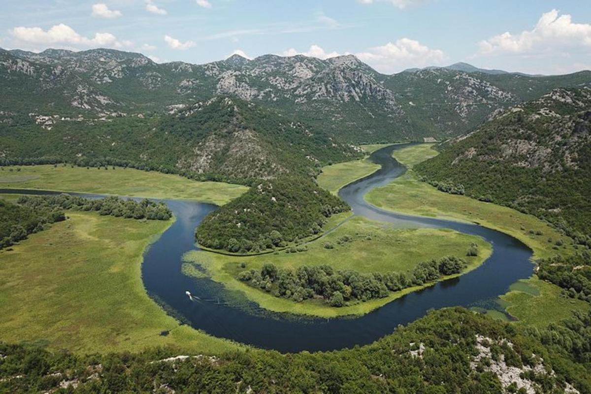 an aerial view of a river in the mountains