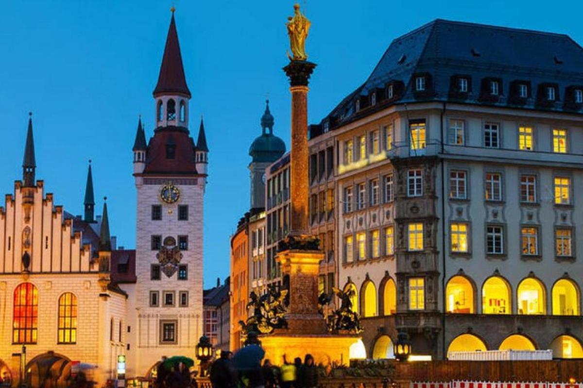 a group of buildings in a city with a clock tower
