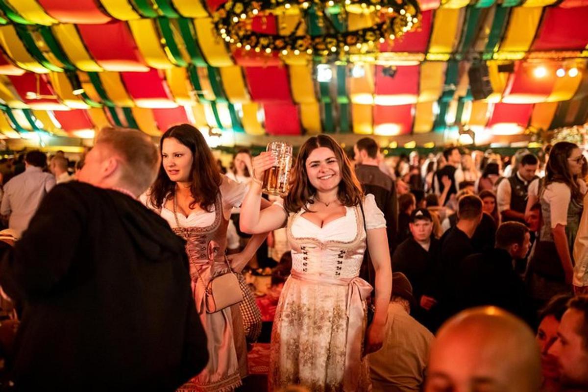 two women walking down a dance floor in a crowd