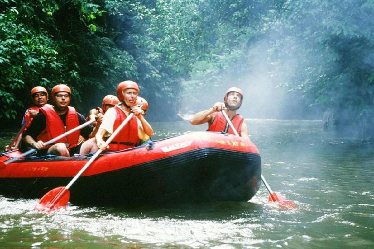 a group of people in a raft on a river