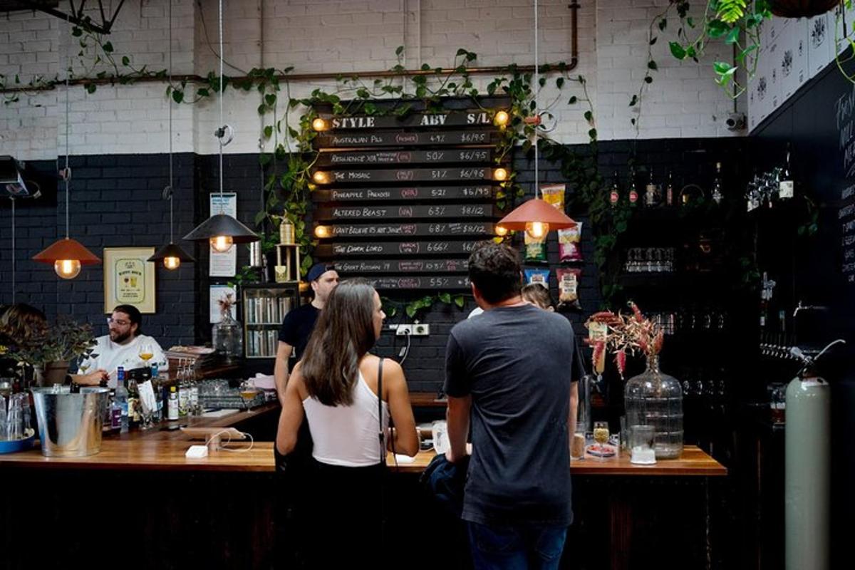 a group of people standing at a bar