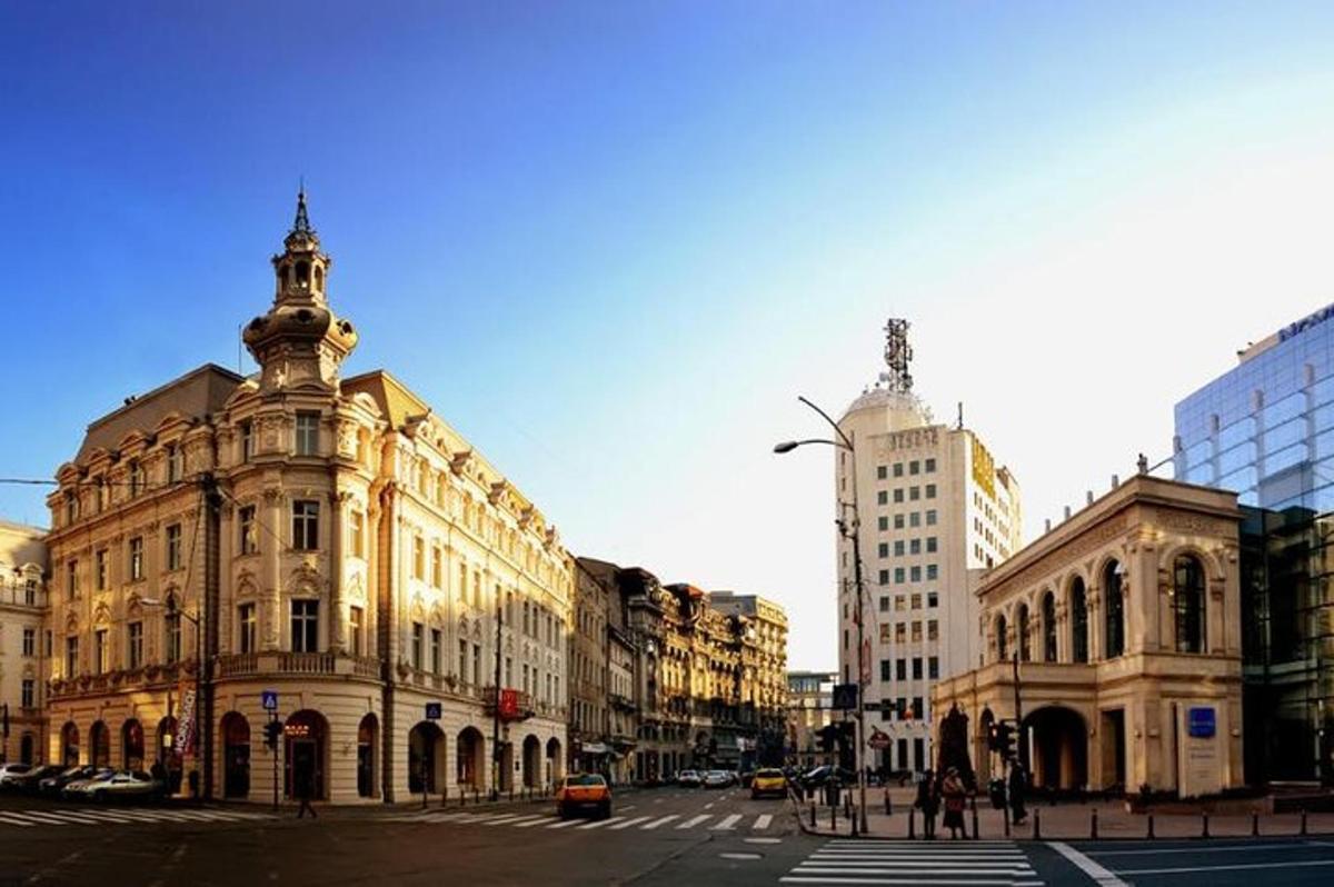 a city street with buildings and a clock tower
