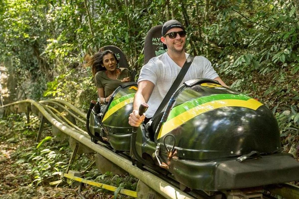 a man and a woman riding on a roller coaster