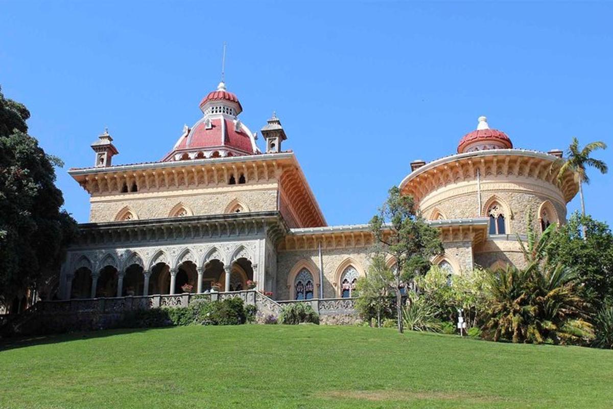a large building with two domes on top of a field