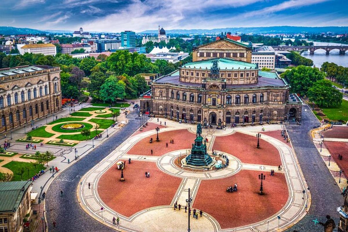 an aerial view of a city with a large building