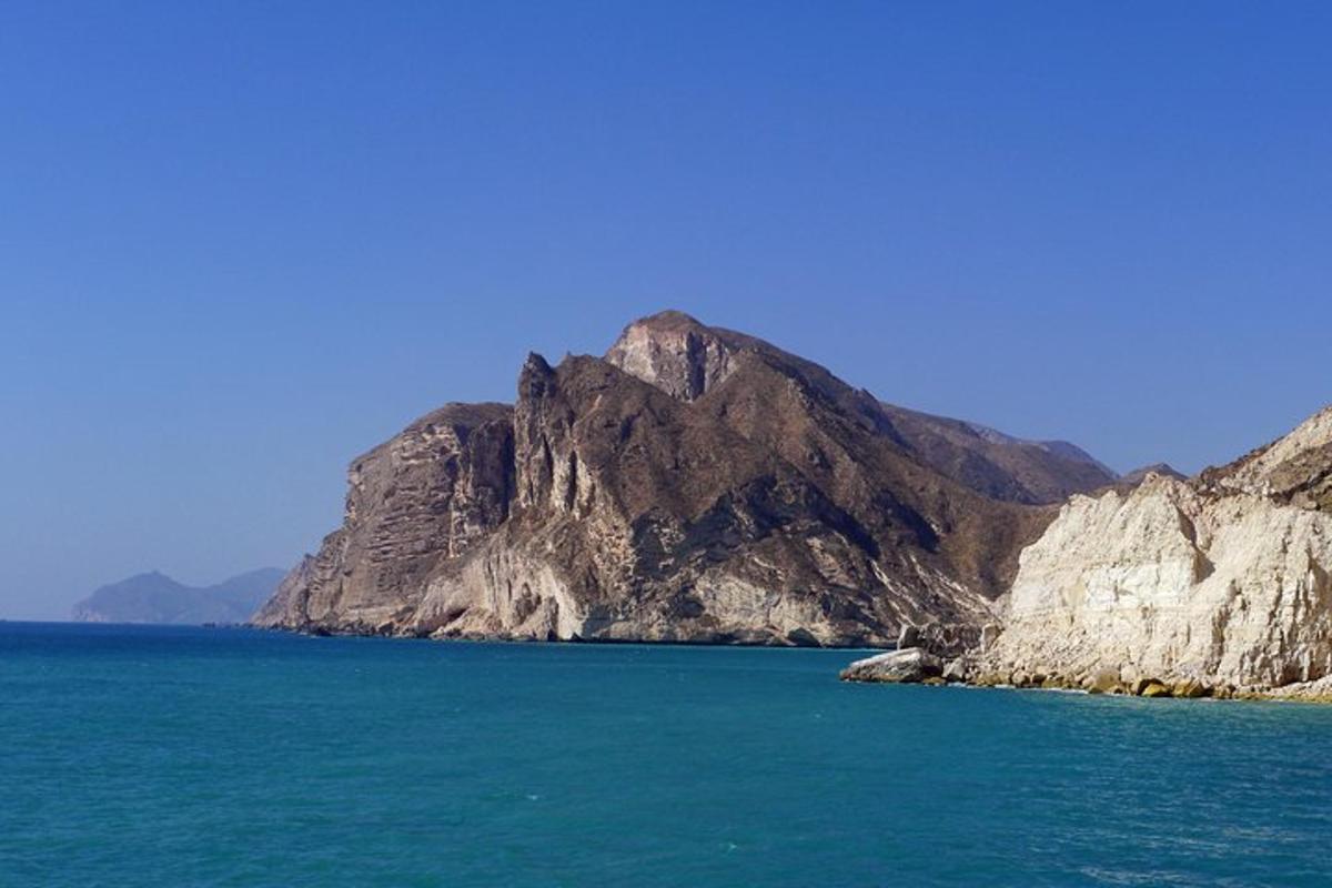 a mountain in the middle of a body of water