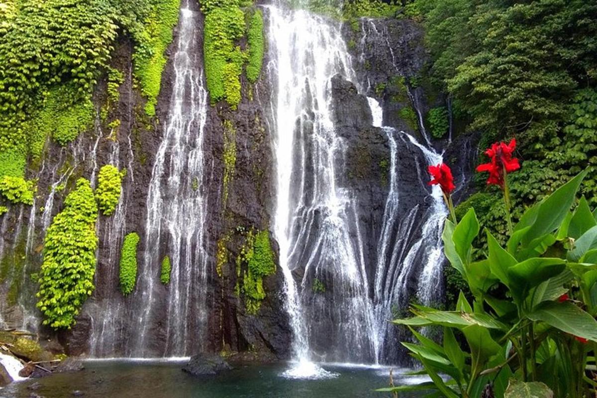 a waterfall on the side of a rock wall
