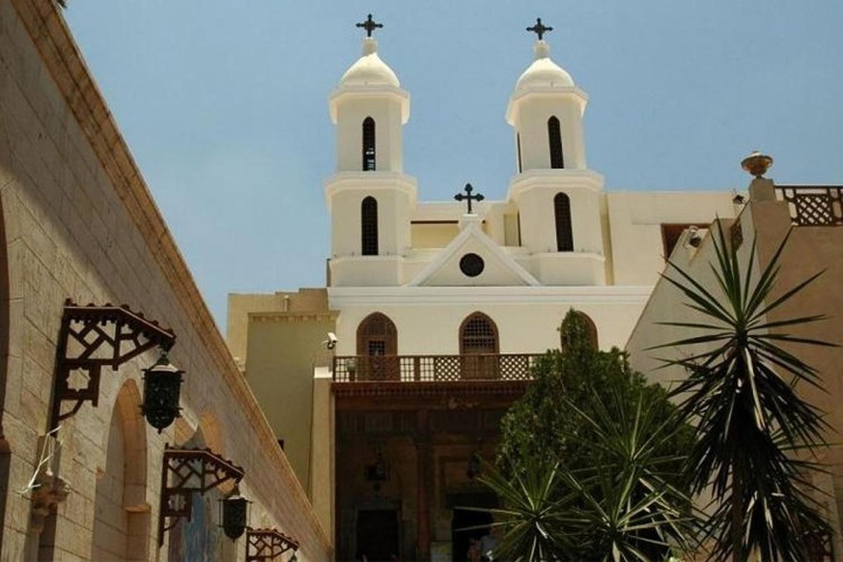 a church with two domes on top of a building