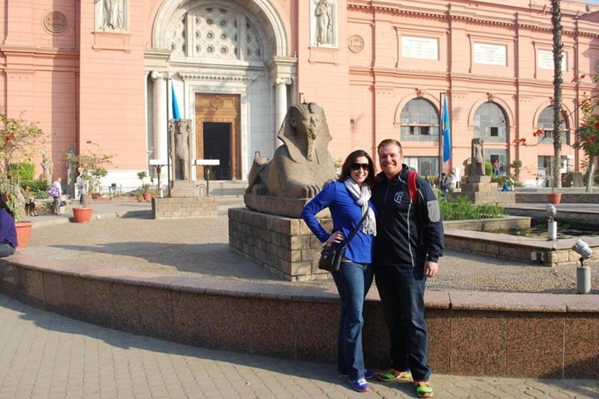 a man and a woman standing in front of a fountain