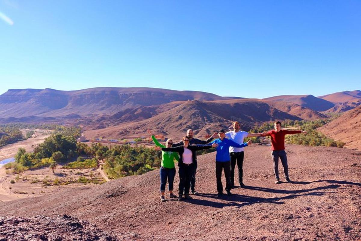 a group of people standing on top of a hill
